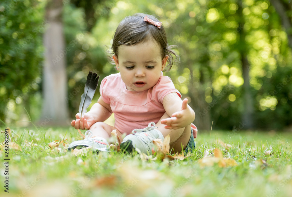 Pretty baby posing in the park Pretty baby posing in the park