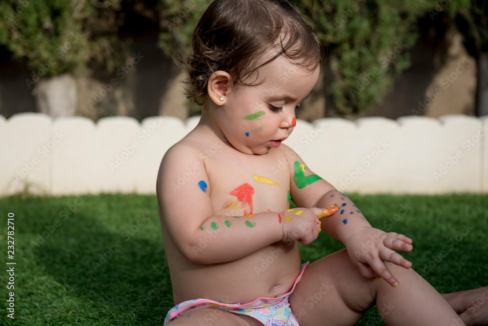 Pretty baby smeared with paints Pretty baby smeared with paints