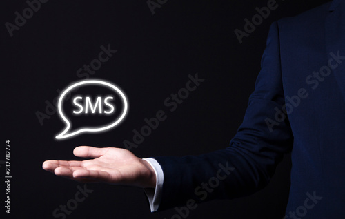 sms icon in businessman hand