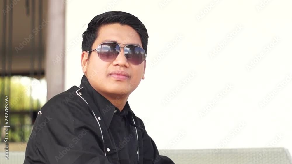 Male groom pose for picture wears sunglasses close-ups. shallow depth of field Male groom pose for picture wears sunglasses close-ups. shallow depth of field