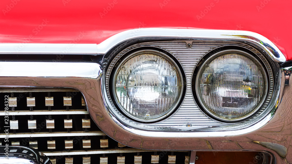 Front headlight of an old retro retro car. Close-up. Motor transport.