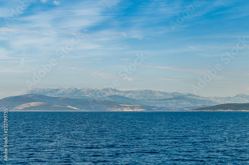 Sea coast and mountains on the horizon in the morning haze