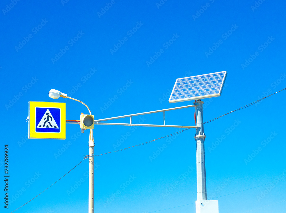 The traffic light works from the solar battery. At the pedestrian crossing a modern traffic light is installed which uses solar energy. The traffic light works from the solar battery. At the pedestrian crossing a modern traffic light is installed which uses solar energy.