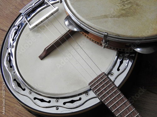 Close-up of two Brazilian musical instruments: samba banjo (strings) and pandeiro (percussion). They are widely used to accompany samba, the most famous Brazilian rhythm. photo