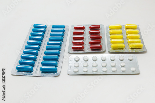 pill packaging and medical supplies on white background