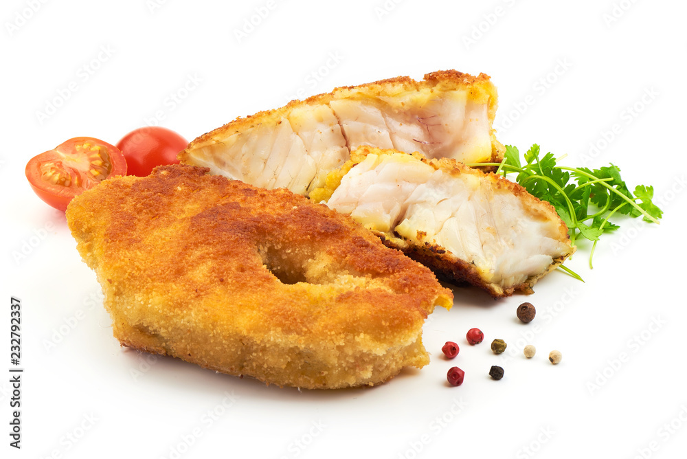 Traditional English food, Fried Fish with herbs, pepper and tomatoes, isolated on a white background. Close-up Traditional English food, Fried Fish with herbs, pepper and tomatoes, isolated on a white background. Close-up