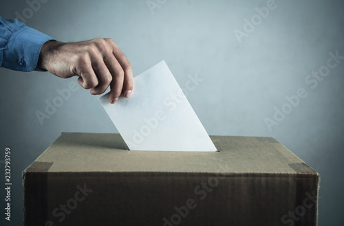 Voting at the ballot box. Election and democracy concept