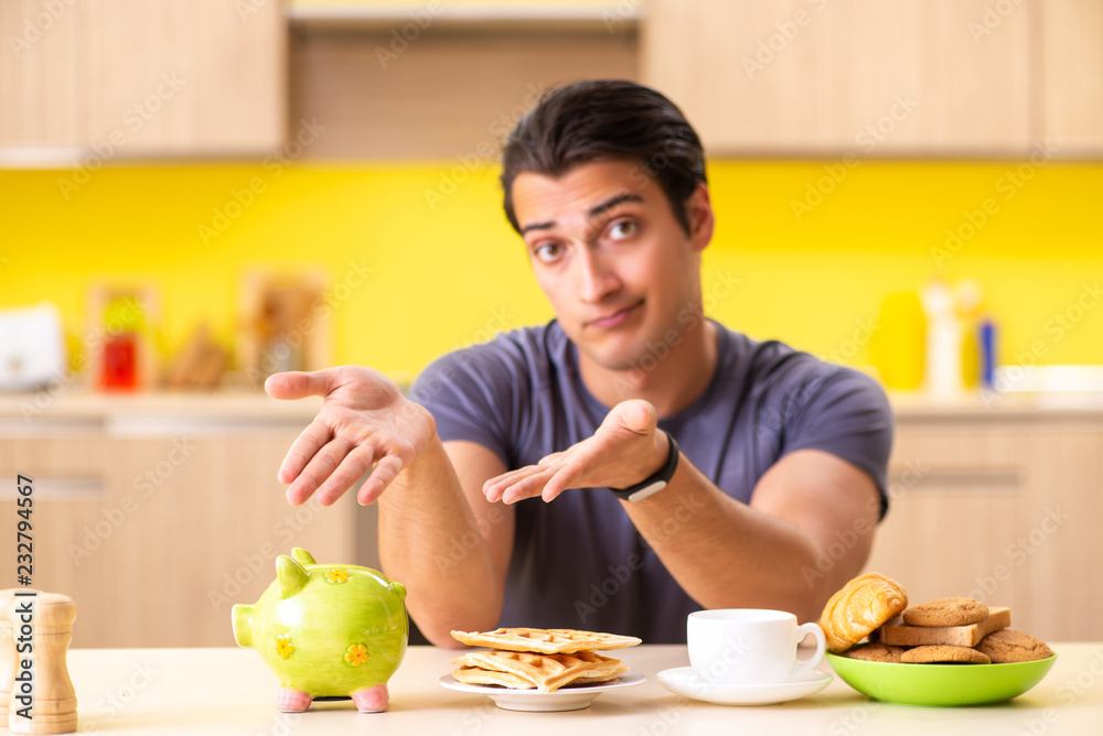 Young man in unhealthy food concept Young man in unhealthy food concept