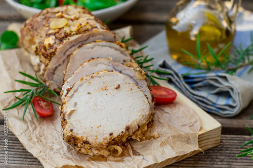 Roast pork loin in mustard marinade with rosemary photo