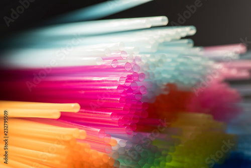 Colorful plastic drinking straws, close up as background photo