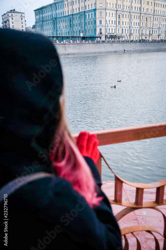 young girl is standing on the bridge in autumn © shutnica