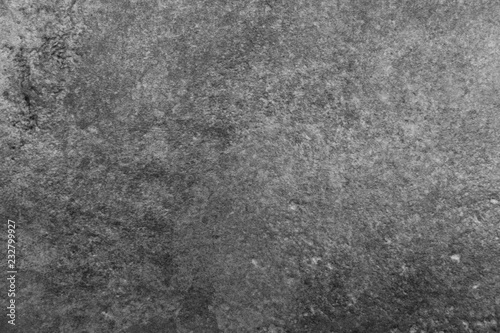 black and white texture of uneven concrete with stains and rough surface
