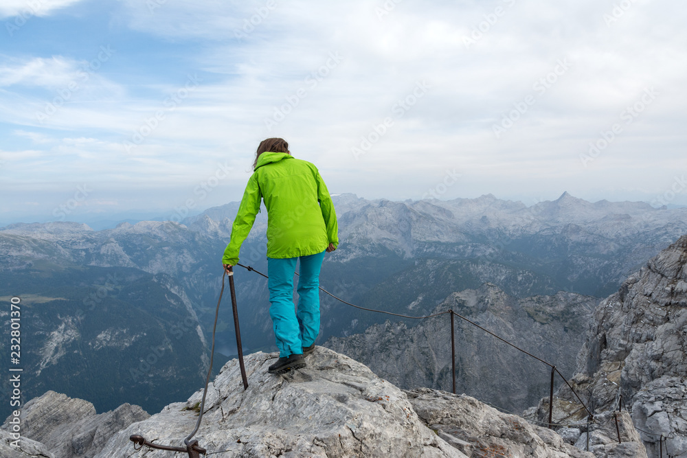 young woman climbing the mountains, Alps