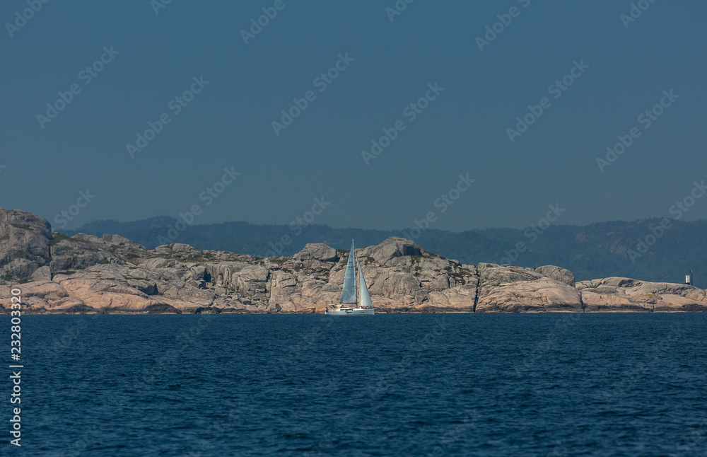 A sailing boat in the Scandinavian archipelago A sailing boat in the Scandinavian archipelago