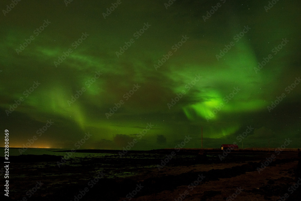 watching aurora borealis during autumn night, Iceland