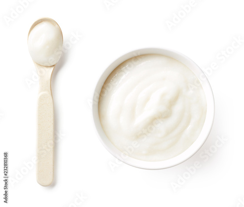 Bowl of baby porridge isolated on white, from above
