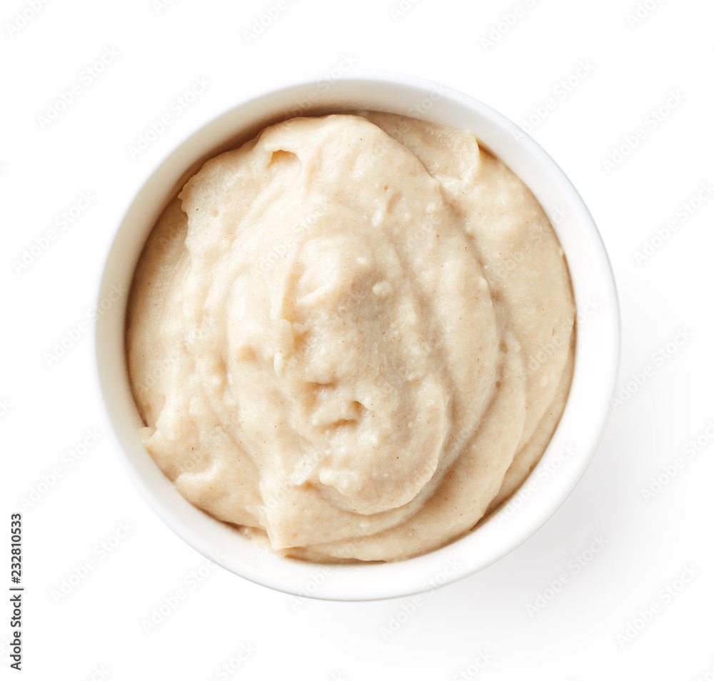 Bowl of baby porridge isolated on white, from above