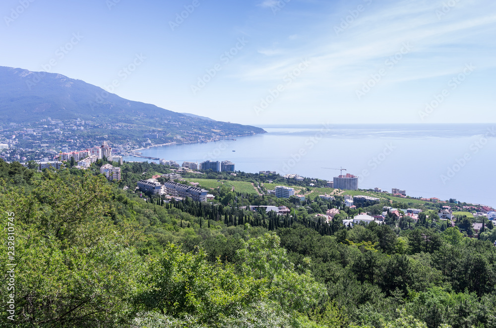 Resort city by the sea. Russia, Republic of Crimea, Yalta. 06.13.2018: View of Yalta and the Black Sea from Mount Ai-Petri