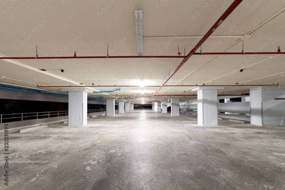 Parking garage interior, industrial building,Empty underground interior in apartment or in supermarket. Parking garage interior, industrial building,Empty underground interior in apartment or in supermarket.
