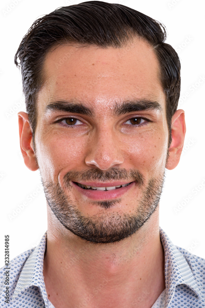Fototapeta premium Face of happy young handsome businessman smiling