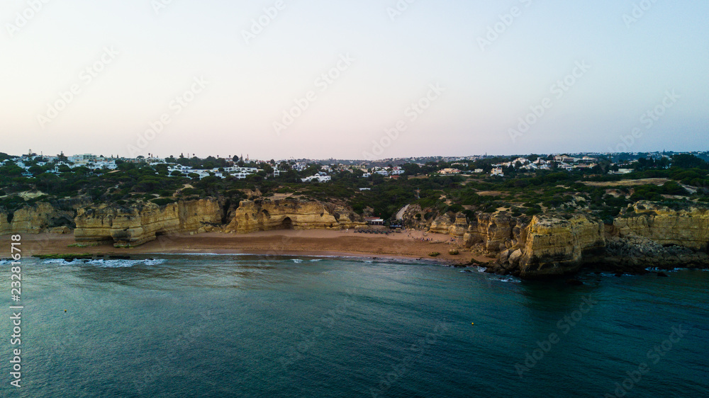 Aerial view of sunset over the coast Algarve coast, Portugal. Concept for above Lagos beach of Portugal. Summer vacations