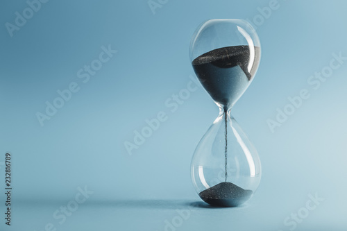 Hourglass on blue background