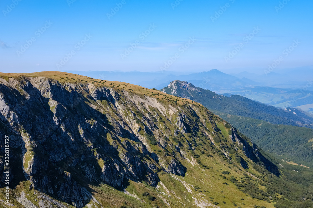 mountain top panorama in autumn covered in mist or clouds mountain top panorama in autumn covered in mist or clouds
