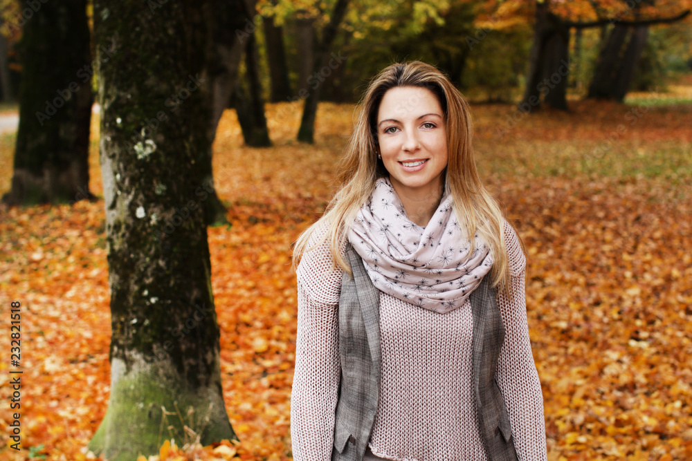 Middle age woman on a walk in nature in autumn Middle age woman on a walk in nature in autumn