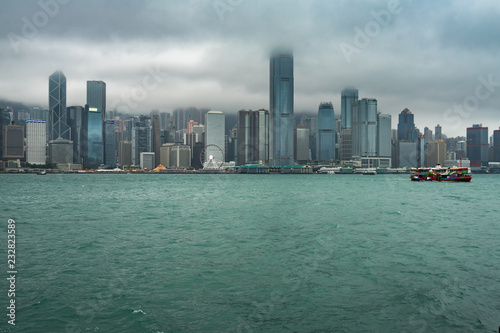 Scenic low clouds over Hong Kong Central skyline viewed from Kowloon Public Pier. Hong Kong, January 2018
