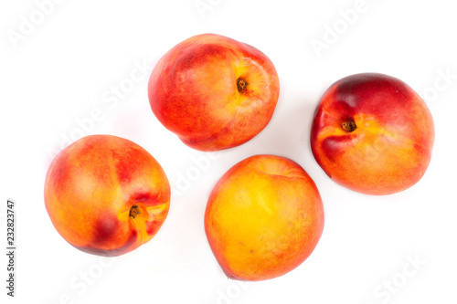 ripe nectarine with leaves isolated on white background. Top view. Flat lay pattern