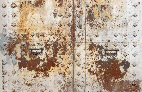 handle and lock of an ancient rusty metallic door