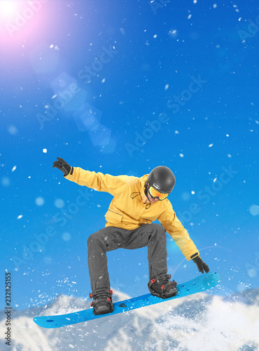 Snowboarder performing a tail grab
