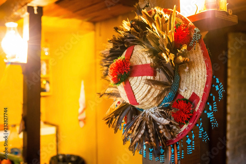 Shaman ritual hat hanging on the wall photo