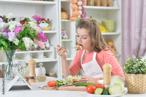 Young girl cooking in kitchen at home