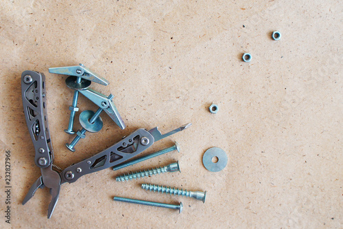 Background from working tools of each man. Washers, nuts, self-tapping screws