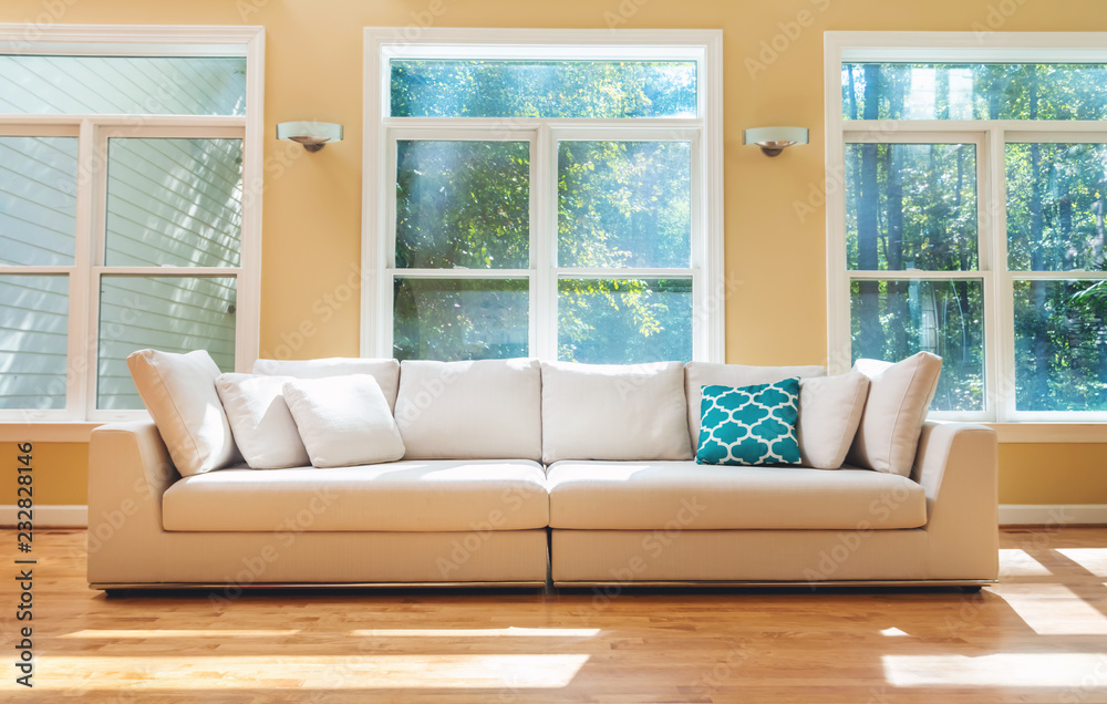 Fototapeta premium Sectional sofa in a large luxury interior home