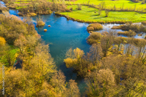Croatia, Mreznica river from air, panoramic view of Belavici village and waterfalls in autumn