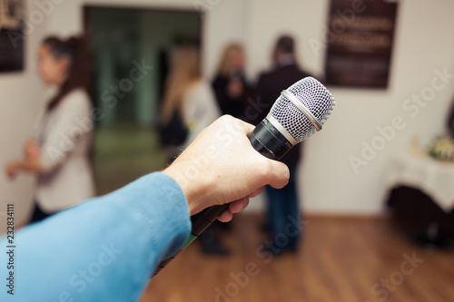 Presenter with a microphone