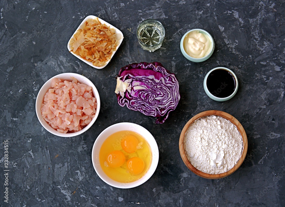 Ingredients for okonomiyaki, national Japanese dish: red cabbage, eggs, flour, mayonnaise, teriyaki sauce, sliced chicken fillet, tuna flakes, frying oil. Ingredients for okonomiyaki, national Japanese dish: red cabbage, eggs, flour, mayonnaise, teriyaki sauce, sliced chicken fillet, tuna flakes, frying oil.