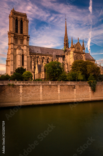 Notre damme cathedral under beautiful colrful sky during golden hour