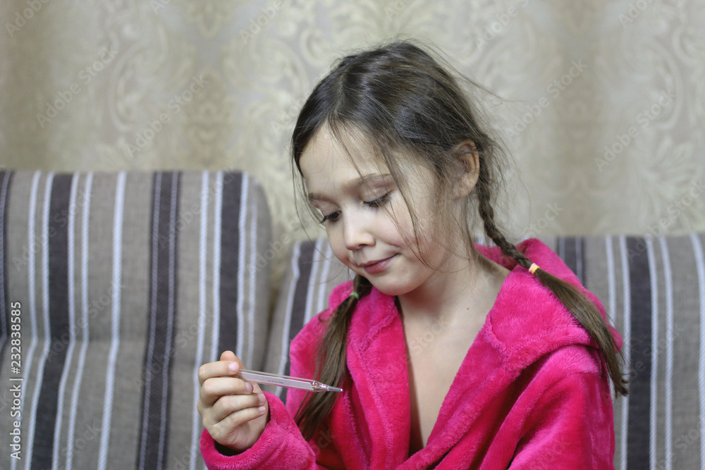 child is sick, measures the temperature with a thermometer child is sick, measures the temperature with a thermometer