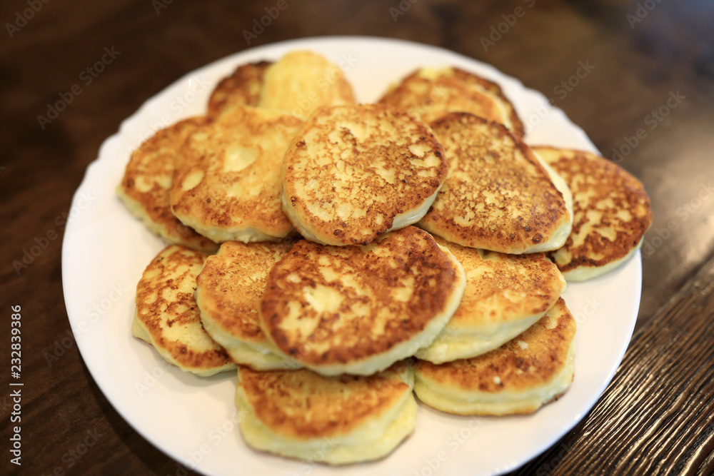 Cottage cheese pancakes on white plate