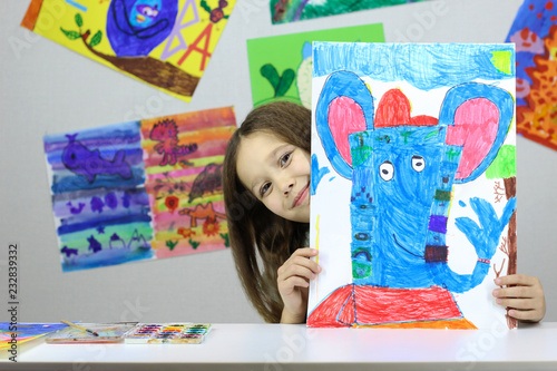 child artist, little girl drew a picture of the God Ganesha