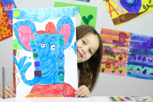 child artist, little girl drew a picture of the God Ganesha