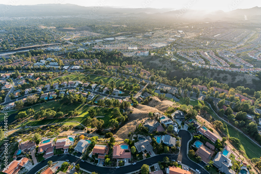 Aerial view of streets, homes and parks in the Porter Ranch area of Los Angeles, California.