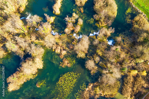 Croatia, Mreznica river from air, top down view, Karlovac county, green nature, beautiful waterfalls in autumn
