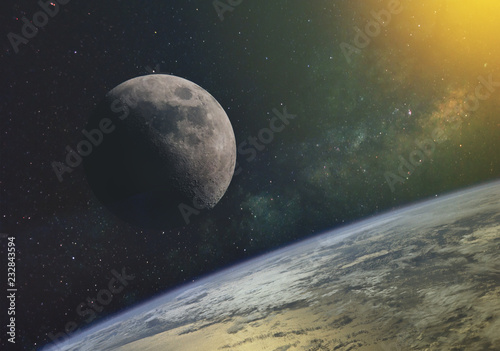 Fototapeta Naklejka Na Ścianę i Meble -  the moon against the milky way and the rays of the sun in the infinite space of the universe in orbit of the earth. Elements of this image furnished by NASA