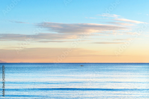 Canoe. Early morning on the beach.