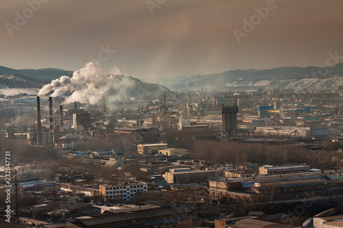 Smoking industrial pipes of the Krasnoyarsk. Black sky mode. Concept of dirty ecology.