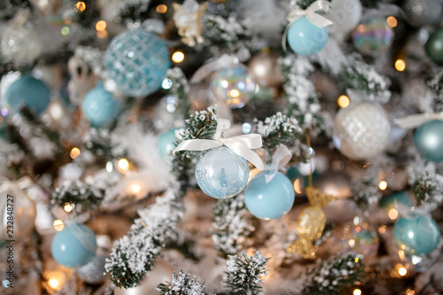Closeup Christmas tree toy light background